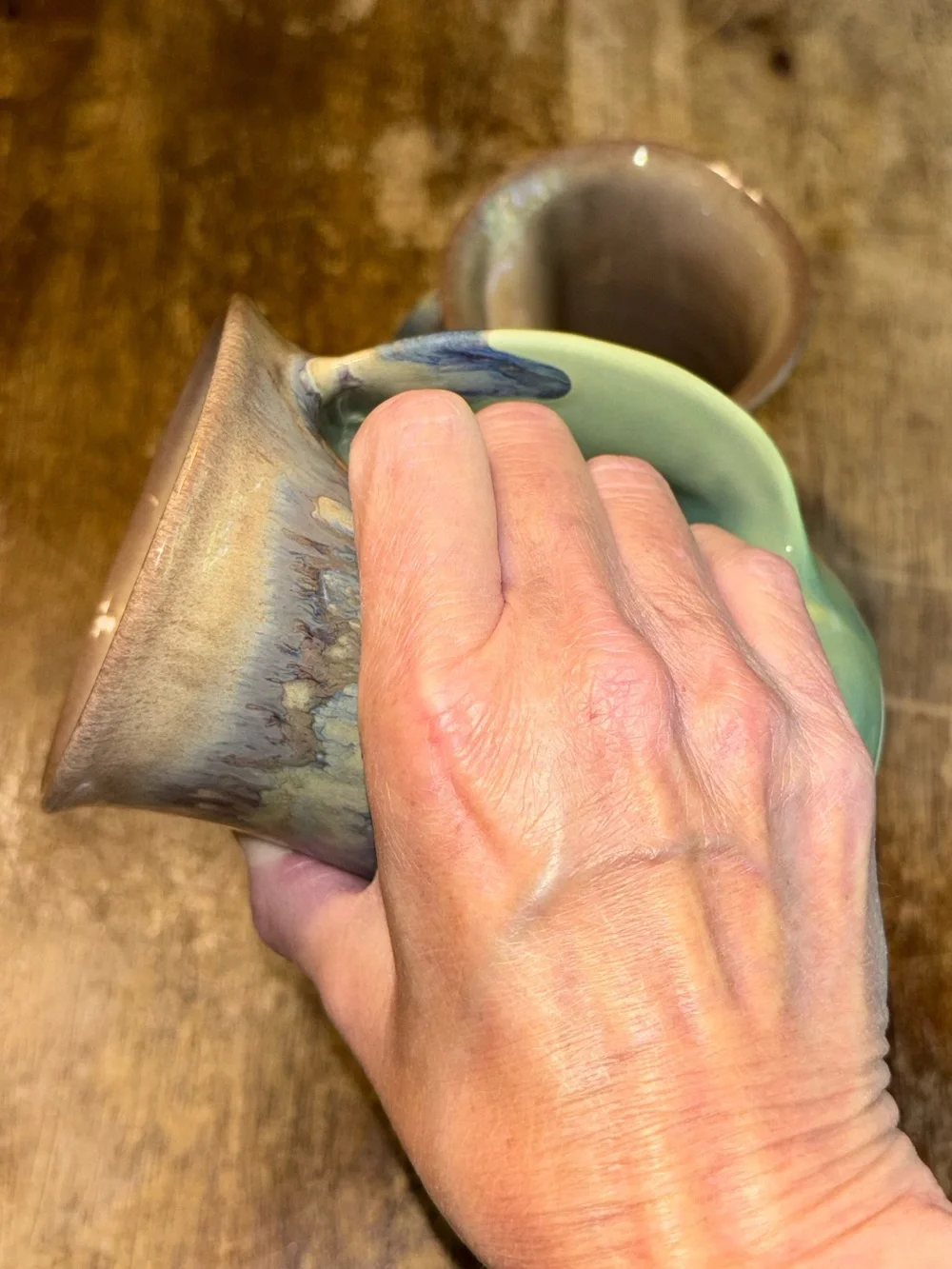2013 & 2017 Neher Clay in Motion Mossy Creek Pottery Hand Warmer Mugs - Set of 2